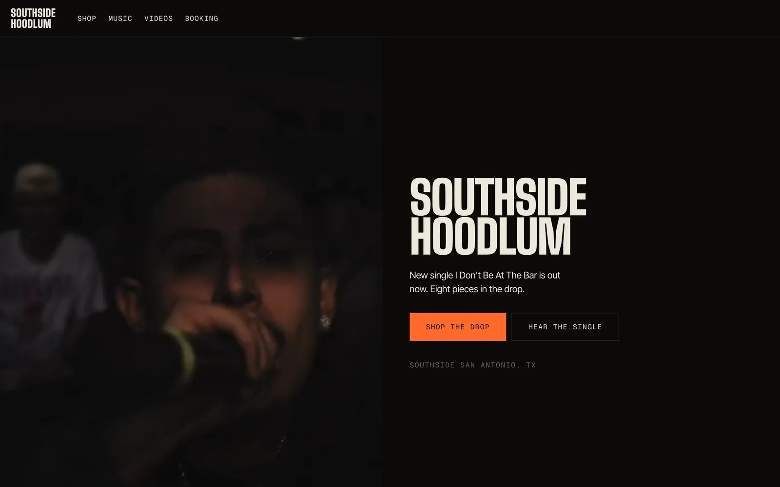 southsidehoodlum.net — the live SOUTHSIDE HOODLUM site: full-bleed performance video beside the wordmark, the new single, and buttons to shop the drop and hear the single